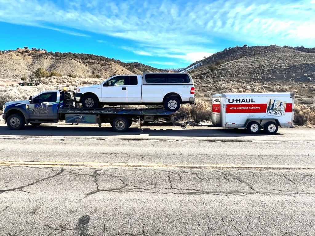 M&H Towing and Recovery picking up a stranded motorist and trailer